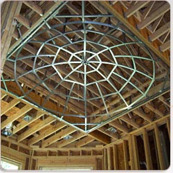 Specialty ceiling with geometric circular pattern.